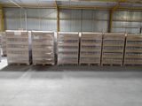 several pallets of water are stacked on pallets in a warehouse