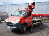 a red truck with a crane on the back of it