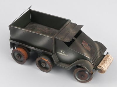 a toy truck that is sitting on a white surface