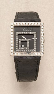 an image of a close up of a wrist watch with diamonds on it