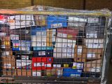 a large metal cage filled with boxes in a warehouse