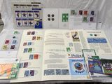 a table with a bunch of stamps and a book on it