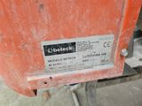 a close up of a metal object with a label on it