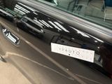 a sticker on the door of a black car