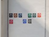 an open book with a picture of different stamps on it