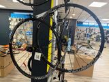 a bike that is sitting on a pole in a store
