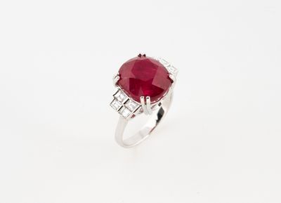 an oval ruby and diamond ring