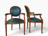 a pair of chairs with leather upholstered back and arms