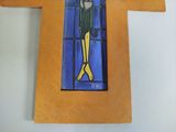 a cross with a picture of a man on it