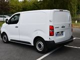 a white van that is parked in a parking lot