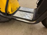 a scooter that is parked in a parking lot