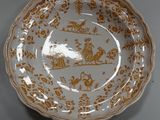 an image of a brown and white plate on a table