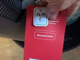 a person holding a red card with a picture on it