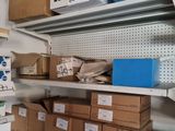 many boxes and boxes on the shelves in the room