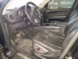 the interior of a car with black leather seats and a steering wheel