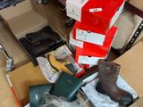 a pile of shoes and other items on the floor