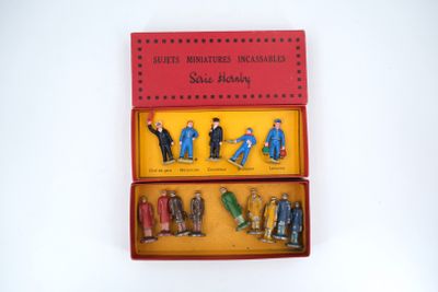 toy figurines in a red box on a white surface