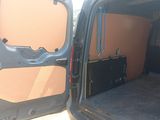 a black van with a brown door and a black trunk