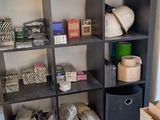 a room that has a shelf with many items in it