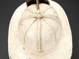 a white hat with a brown band around the brim