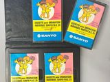 three nintendo game cartridges sitting on top of a table next to each other