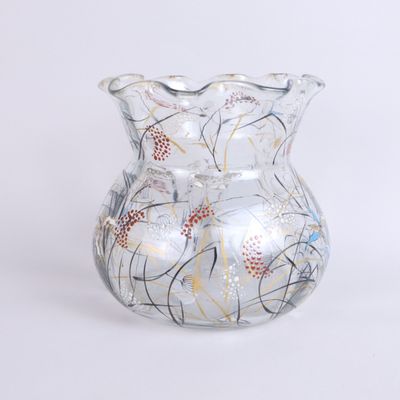 a glass vase with a design on it on a white background