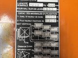 a sign on the side of a machine that is on the wall