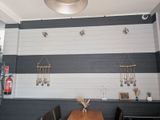a picture of a dining room with a wooden table and chairs