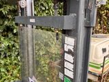 a black and white picture of a phone booth in the yard