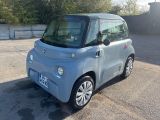 a small car that is parked in a parking lot