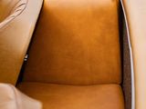 a brown leather seat in the back of a car