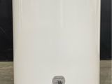 a white water heater sitting on the floor