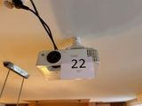 a video projector hanging from the ceiling with a price tag attached to it