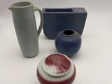 three different types of vases on a white table