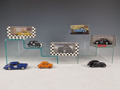 several toy cars are on display in a glass display case