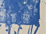 an image of a blue and white drawing of a person on a chair