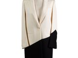 the coat is black and white and has a black and white color block