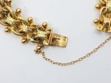 an image of a close up of a necklace on a white surface