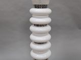 a white lamp that is sitting on a table