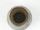 a close up view of a glass with a liquid in it