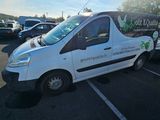 a white van that is parked in a parking lot