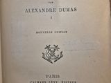 an old book with a black and white image of the title of a novel