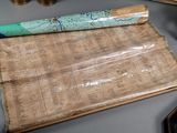 a roll of paper with a map on it on a table