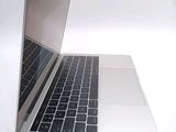 a close up of a laptop computer on a white surface