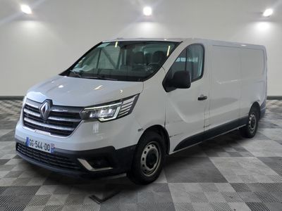 the white van is parked on a checkered floor in a room