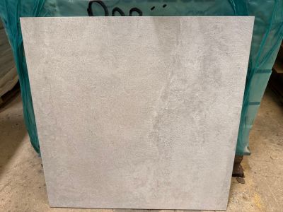 a large piece of white marble sitting on top of a table