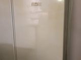 a white refrigerator sitting in a kitchen next to a counter