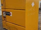 a yellow box that is sitting in the dirt