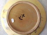 a plate with a smiley face on it on a table