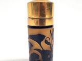 an image of a gold and black bottle with a dragon on it